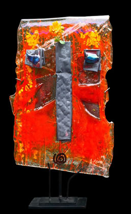 Kiln-formed glass scupture entitled "Orange Elvis"
