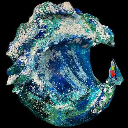Abstract kiln formed glass sculpture on a custom steel base titled, "Free Fall"