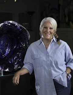 Suzanne with a kiln formed glass sculpture.