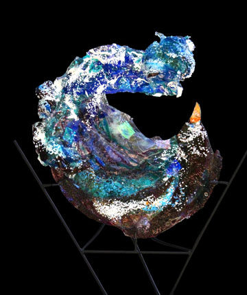 Kiln formed glass sculpture titled "Into the Wind".