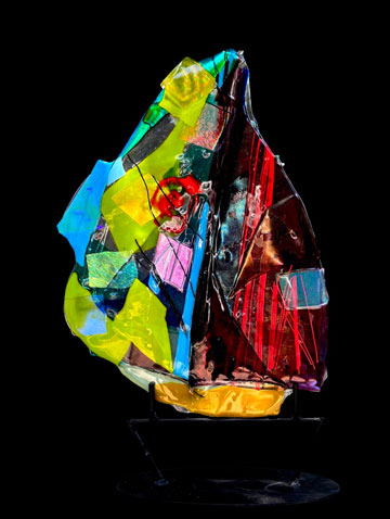 Kiln formed glass mounted on a custom steel base Titled "Sailing With a Smile"