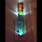 Lighted, wall-mounted kiln formed glass sculpture.