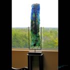 Tall kiln formed glass sculpture titled "Rain Spirit"