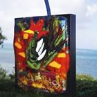 Outdoor kiln formed glass sculpture titled "The Shopper" in St. Croix, U.S. Virgin Islands